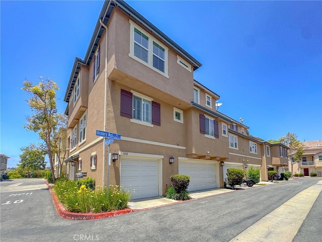 1652 Hickory Nut Pl, Chula Vista, CA 91915 - view of front of home featuring stucco siding, a residential view, and a garage