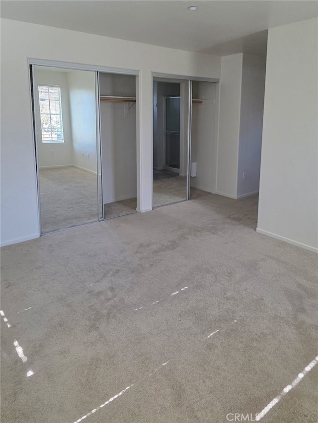 1652 Hickory Nut Pl, Chula Vista, CA 91915 - unfurnished bedroom featuring two closets and carpet flooring