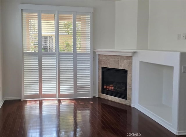 1652 Hickory Nut Pl, Chula Vista, CA 91915 - unfurnished living room with a tiled fireplace and wood-type flooring