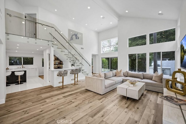24523 Via Esquina, Calabasas, CA 91302 - living room with high vaulted ceiling, wood-type flooring, stairs, and recessed lighting