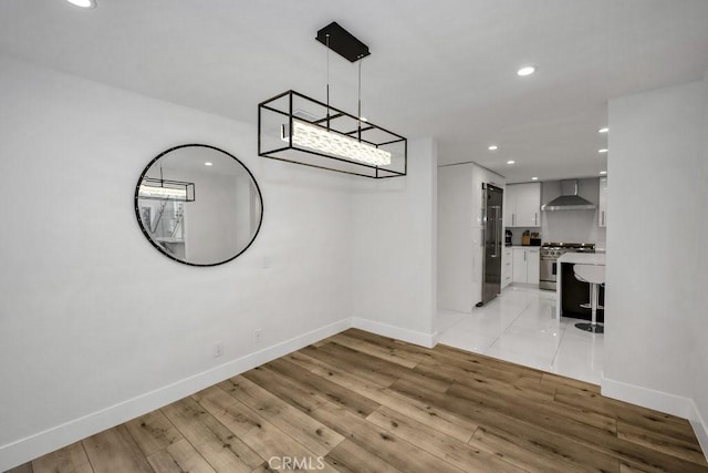 24523 Via Esquina, Calabasas, CA 91302 - unfurnished dining area featuring light wood-style flooring and recessed lighting