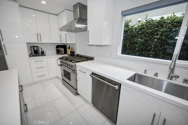 24523 Via Esquina, Calabasas, CA 91302 - kitchen featuring wall chimney exhaust hood, stainless steel appliances, light countertops, and white cabinets