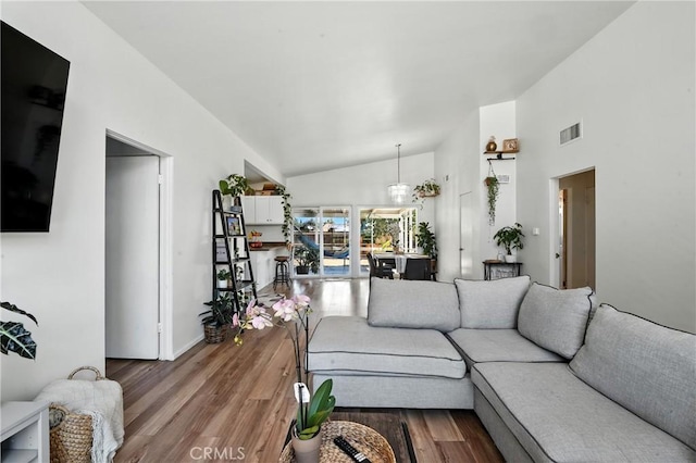 951 W Olive St, Corona, CA 92882 - living area featuring wood finished floors and high vaulted ceiling