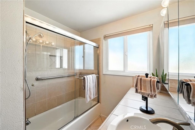 951 W Olive St, Corona, CA 92882 - full bath with plenty of natural light, enclosed tub / shower combo, and double vanity