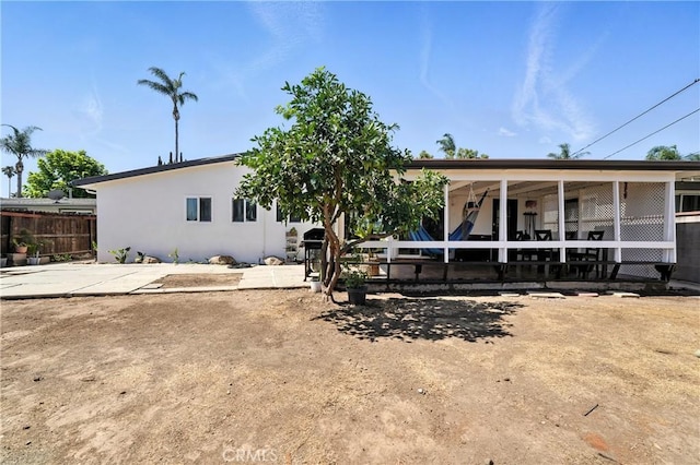 951 W Olive St, Corona, CA 92882 - back of property featuring stucco siding and a patio area