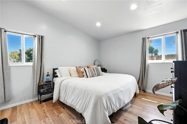 951 W Olive St, Corona, CA 92882 - bedroom featuring multiple windows, vaulted ceiling, light wood-style floors, and recessed lighting