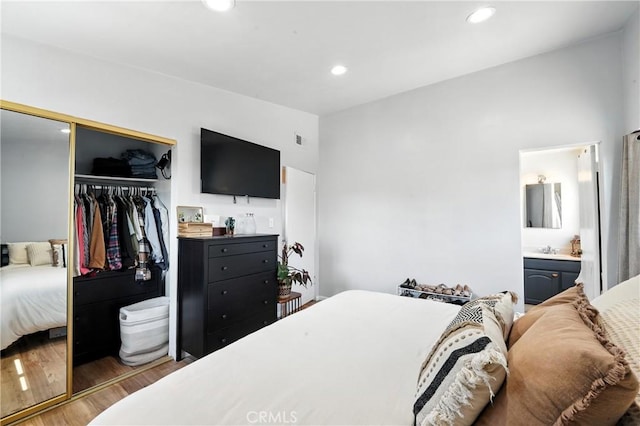 951 W Olive St, Corona, CA 92882 - bedroom with wood finished floors, a closet, recessed lighting, and ensuite bathroom