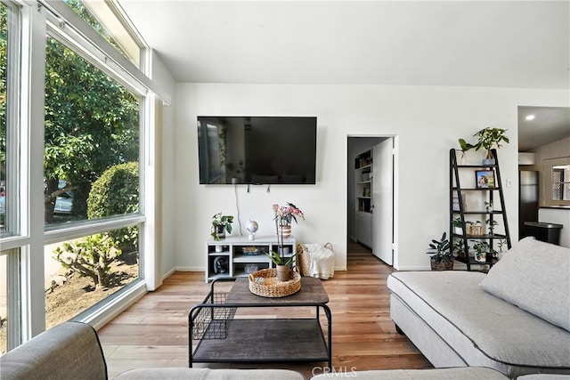 951 W Olive St, Corona, CA 92882 - living room featuring healthy amount of natural light and wood finished floors