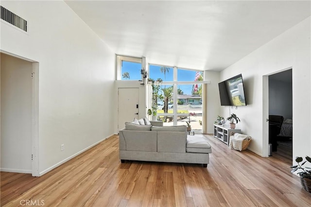 951 W Olive St, Corona, CA 92882 - living room with light wood finished floors and lofted ceiling