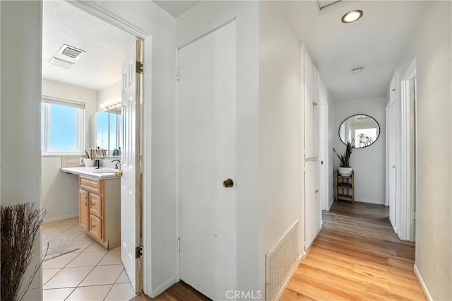 951 W Olive St, Corona, CA 92882 - hall with a sink and baseboards