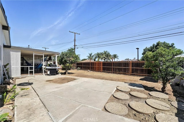 951 W Olive St, Corona, CA 92882 - fenced backyard featuring a patio and a grill