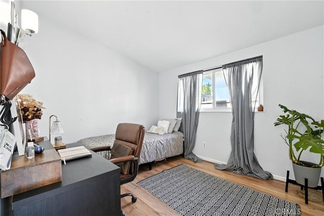 951 W Olive St, Corona, CA 92882 - bedroom featuring wood finished floors, vaulted ceiling, and a desk