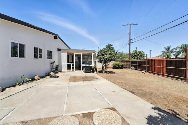 951 W Olive St, Corona, CA 92882 - fenced backyard with a patio area and a sunroom
