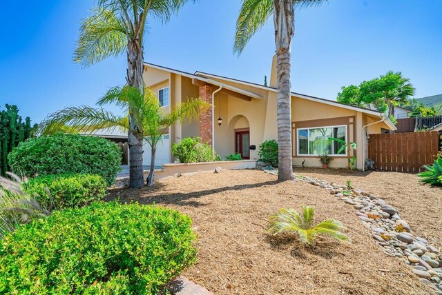 15020 Penasquitos Dr, Rancho Penasquitos, CA 92129 - mid-century modern home featuring stucco siding and a garage