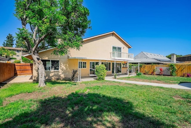 15020 Penasquitos Dr, Rancho Penasquitos, CA 92129 - rear view of house with a fenced backyard, a balcony, a patio area, and stucco siding