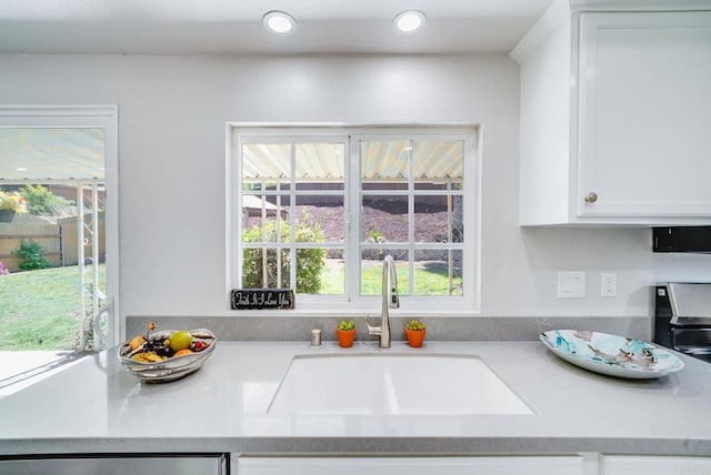 15020 Penasquitos Dr, Rancho Penasquitos, CA 92129 - kitchen with light countertops, white cabinetry, recessed lighting, and dishwasher