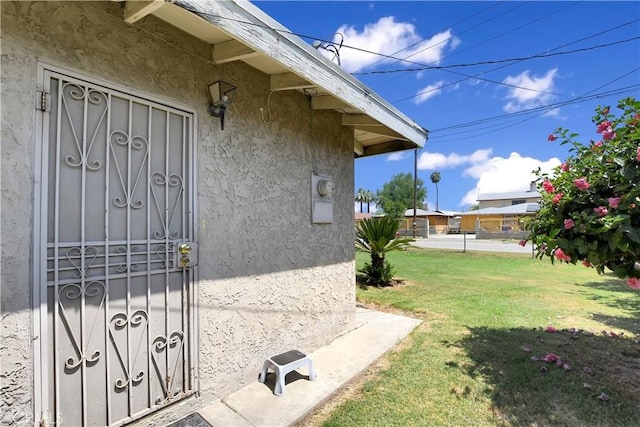 1582 Hardt St, San Bernardino, CA 92408 - entrance to property featuring stucco siding and a yard