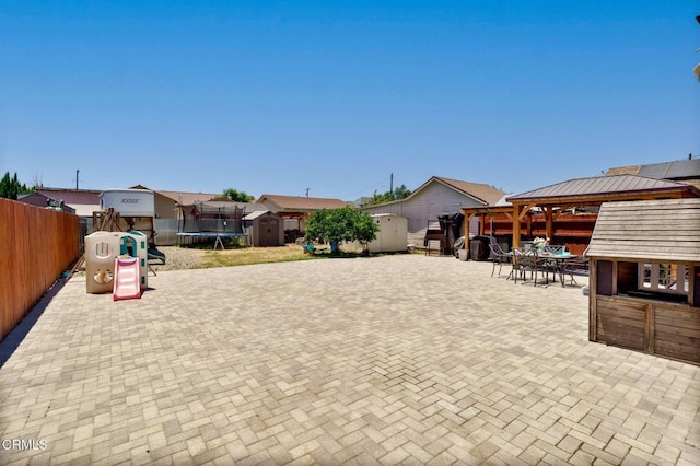 208 S 4th St, Santa Paula, CA 93060 - fenced backyard featuring a shed, a trampoline, a gazebo, a patio area, and outdoor dining space