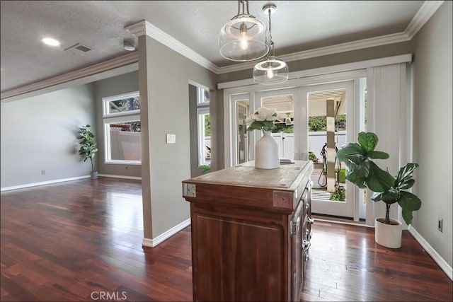 25225 Avenida Tranquila, Lake Forest, CA 92630 - kitchen with dark wood-style floors, crown molding, pendant lighting, and a kitchen island