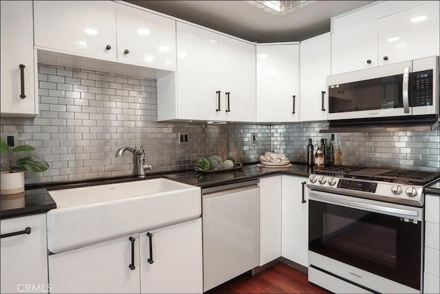 25225 Avenida Tranquila, Lake Forest, CA 92630 - kitchen with stainless steel appliances, backsplash, and dark countertops