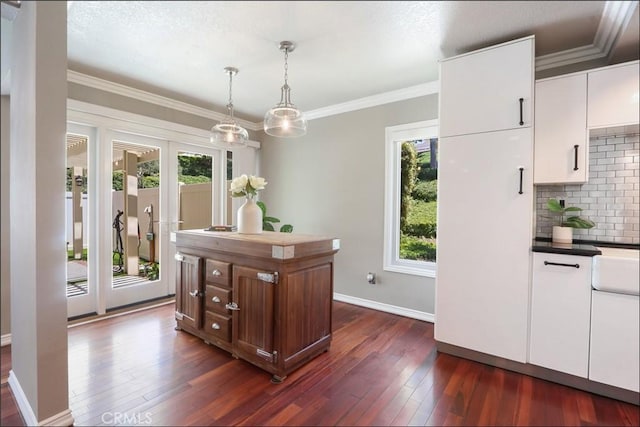 25225 Avenida Tranquila, Lake Forest, CA 92630 - dining room featuring healthy amount of natural light, dark wood finished floors, and ornamental molding