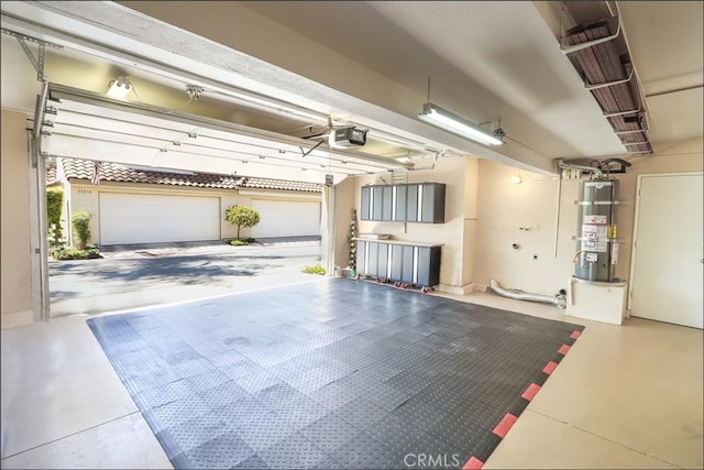 25225 Avenida Tranquila, Lake Forest, CA 92630 - garage featuring strapped water heater and a garage door opener