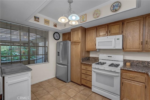 1645 Clark Ave Unit 115, Long Beach, CA 90815 - kitchen with white appliances, brown cabinetry, a chandelier, and light tile patterned flooring