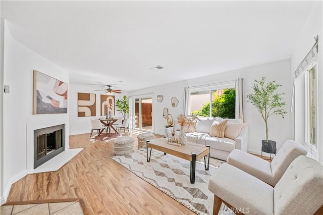 23640 Monument Canyon Dr Unit C, Diamond Bar, CA 91765 - living area with wood finished floors, ceiling fan, and a fireplace