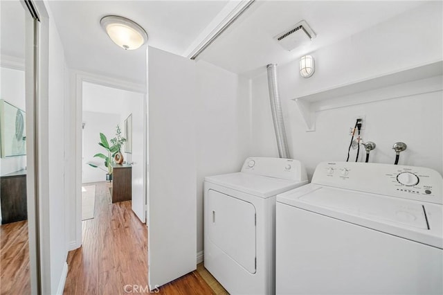 23640 Monument Canyon Dr Unit C, Diamond Bar, CA 91765 - laundry room with washer and dryer and light wood-type flooring