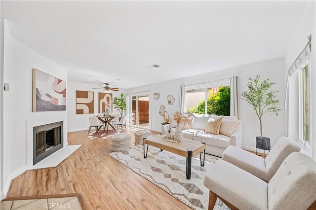 23640 Monument Canyon Dr Unit C, Diamond Bar, CA 91765 - living room with wood finished floors, a ceiling fan, and a fireplace
