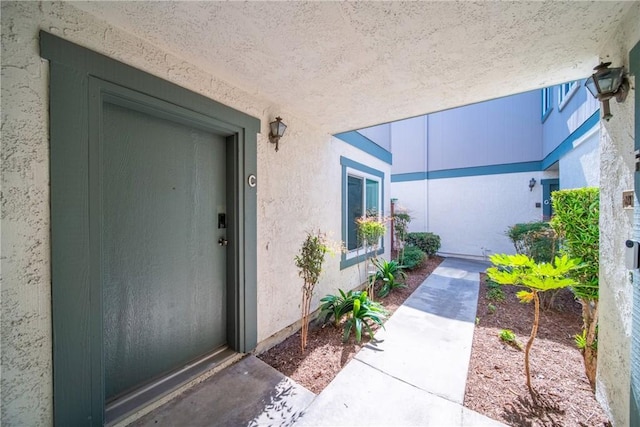 23640 Monument Canyon Dr Unit C, Diamond Bar, CA 91765 - view of exterior entry with stucco siding