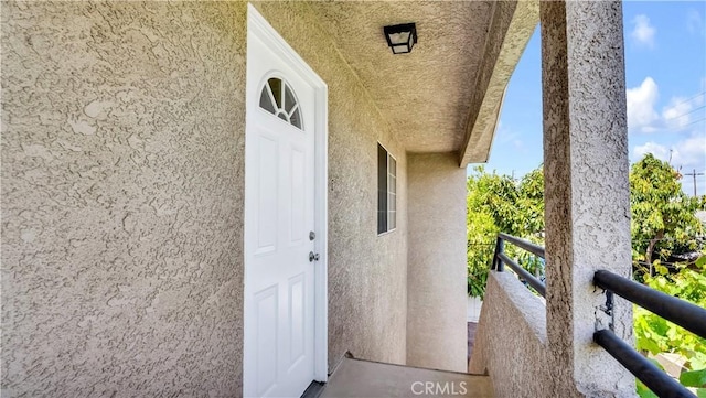 2116 Marine Ave, Gardena, CA 90249 - entrance to property with a balcony and stucco siding