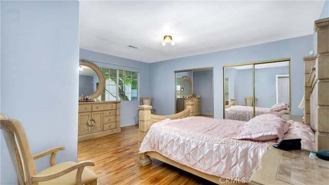 2116 Marine Ave, Gardena, CA 90249 - bedroom featuring multiple closets and wood finished floors