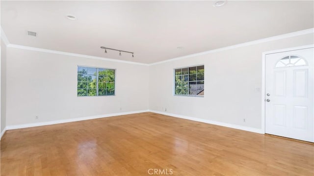 2116 Marine Ave, Gardena, CA 90249 - empty room featuring track lighting, plenty of natural light, light wood-style flooring, and crown molding