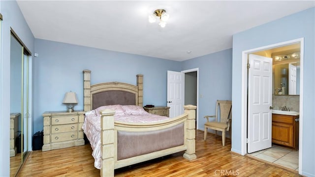 2116 Marine Ave, Gardena, CA 90249 - bedroom with light wood-style floors, ensuite bath, and a closet