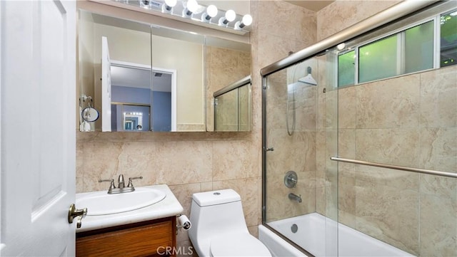 2116 Marine Ave, Gardena, CA 90249 - bathroom with tile walls, vanity, and combined bath / shower with glass door