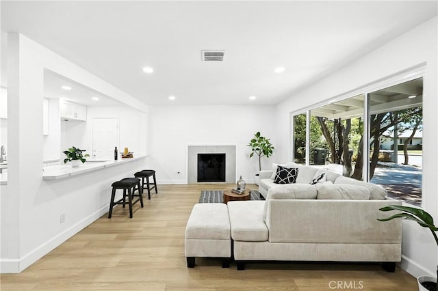 1170 Turquoise St, Hemet, CA 92543 - living room featuring recessed lighting, light wood finished floors, and a fireplace