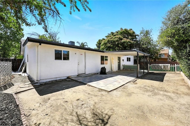 1170 Turquoise St, Hemet, CA 92543 - rear view of house with stucco siding and a patio