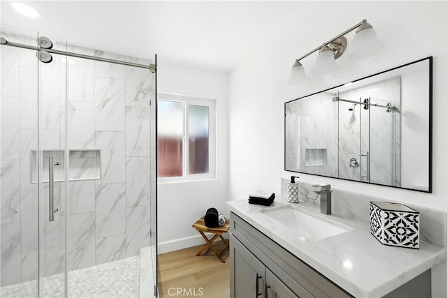 1170 Turquoise St, Hemet, CA 92543 - bathroom with a marble finish shower, vanity, and wood finished floors