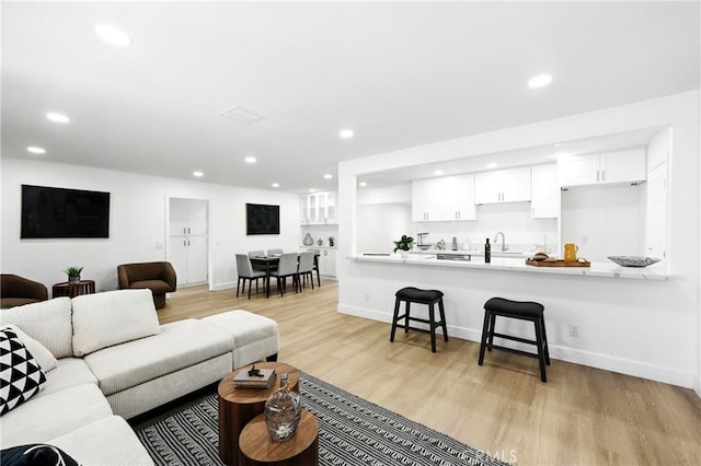 1170 Turquoise St, Hemet, CA 92543 - living room featuring recessed lighting and light wood-style flooring
