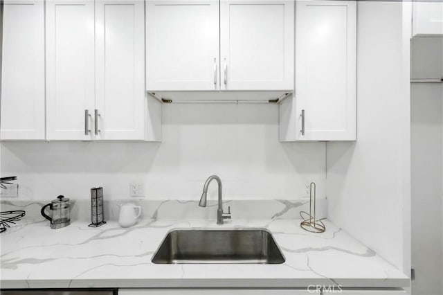 1170 Turquoise St, Hemet, CA 92543 - kitchen featuring white cabinets and light stone countertops