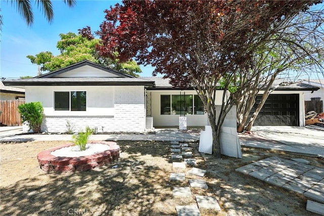 1170 Turquoise St, Hemet, CA 92543 - ranch-style home featuring brick siding, concrete driveway, and a garage