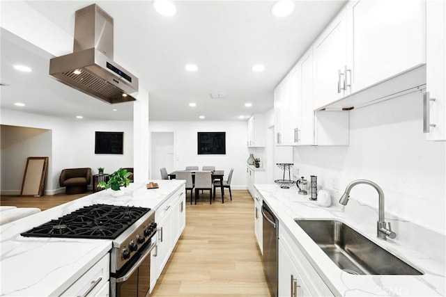 1170 Turquoise St, Hemet, CA 92543 - kitchen featuring appliances with stainless steel finishes, island exhaust hood, white cabinetry, recessed lighting, and light wood-type flooring