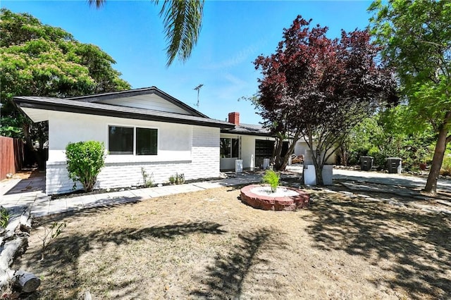 1170 Turquoise St, Hemet, CA 92543 - view of front facade with brick siding and a chimney