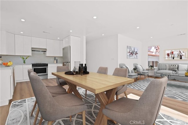 30313033 Vineyard Ave, Los Angeles, CA 90016 - dining area featuring light wood-type flooring and recessed lighting