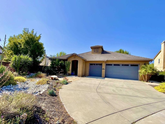 2977 Rangpur Ct, Escondido, CA 92027 - view of front facade with an attached garage, concrete driveway, a tile roof, and stucco siding