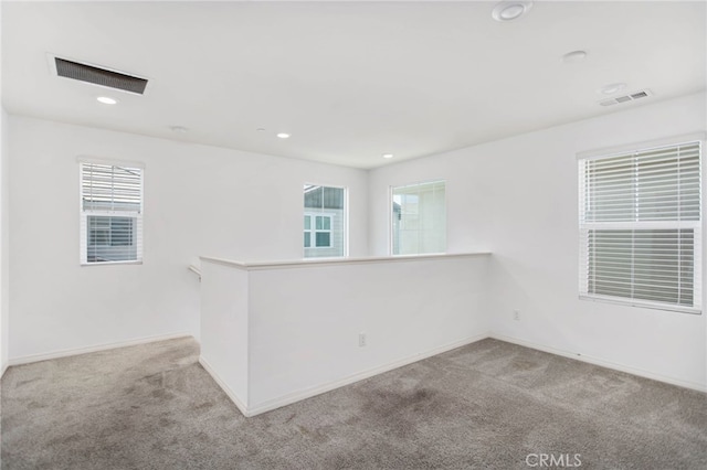 13946 Blossom Way, Eastvale, CA 92880 - carpeted empty room with plenty of natural light and recessed lighting