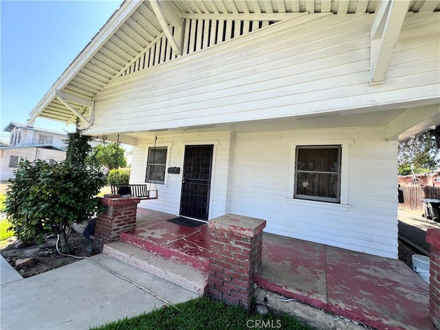 3855 Maine Ave, Baldwin Park, CA 91706 - doorway to property with a porch