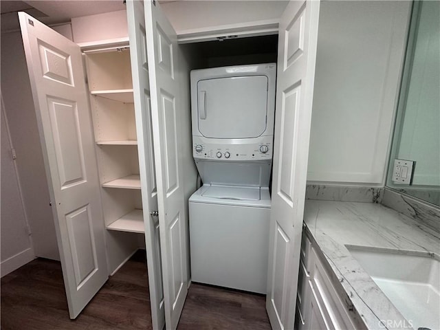 1501 Pelham Unit 127F, Seal Beach, CA 90740 - laundry area with stacked washer / dryer and dark wood-type flooring