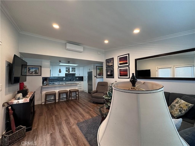 1501 Pelham Unit 127F, Seal Beach, CA 90740 - living area featuring an AC wall unit, ornamental molding, dark wood-style flooring, and recessed lighting